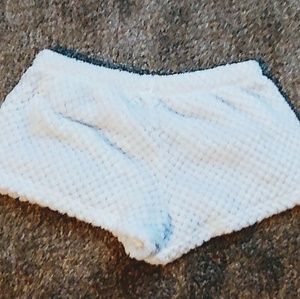 F21 white shorts with soft pom poms all around.